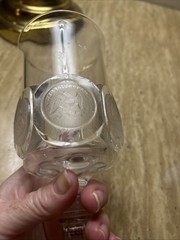 Decorative glass goblet with applied United States themed medallions.