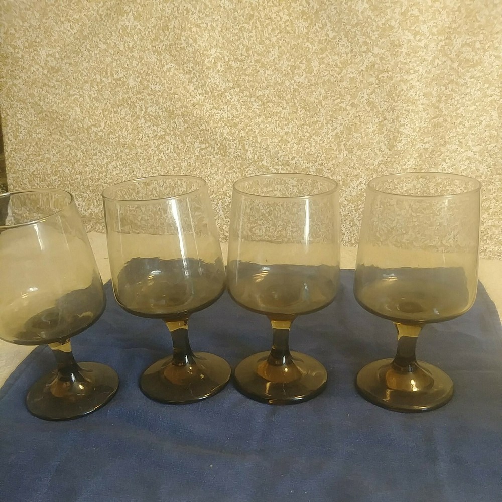 Vintage Smoky Stemed Glasses set of 4. 6inches tall 3inches across the top