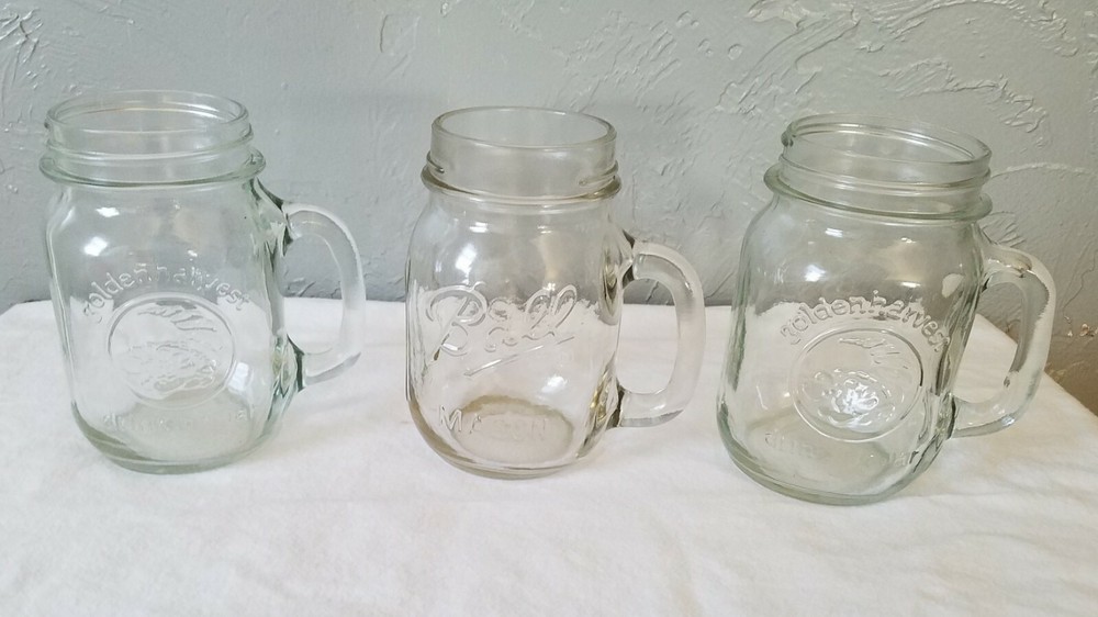 Two Clear Glass Golden Harvest and One Ball Pint Sized Handled Drinking Jars