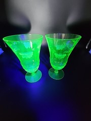 2 Glowy vintage Uranium Glass Footed Tumblers etched with Daisy Leaf 6 In. READ