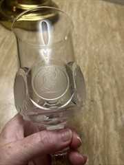 Decorative glass goblet with applied United States themed medallions.