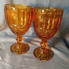 Amber colored glass pedestal goblets, Pair