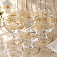 Set Of 4 Baccarat crystal gilded water goblet in the Flora pattern. Signed