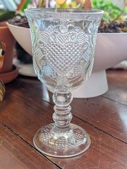 1978 Avon glass goblet produced by Fostoria in the «Hearts and Diamonds» pressed