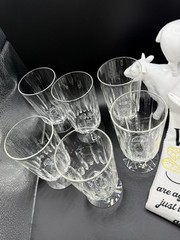 (6) Footed Crystal Water/Juice Glasses-5 1/2″ x 3″ with a wafer Design on stem.