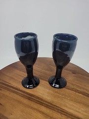 Two Black Art Pottery Wine Glasses Signed LH Evans Black