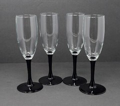 Set of 4 Vintage Fluted Champagne Glasses With Clear Tops And Black Stems