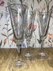 Set of 4 Mikasa Wheaton Like glass fluted champagne flutes with twisted stems.