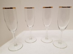 Four long stemmed gold rimmed wine glasses item no. 4-508