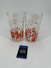 Two vintage mid-century modern tumblers with floral and geometric pattern.