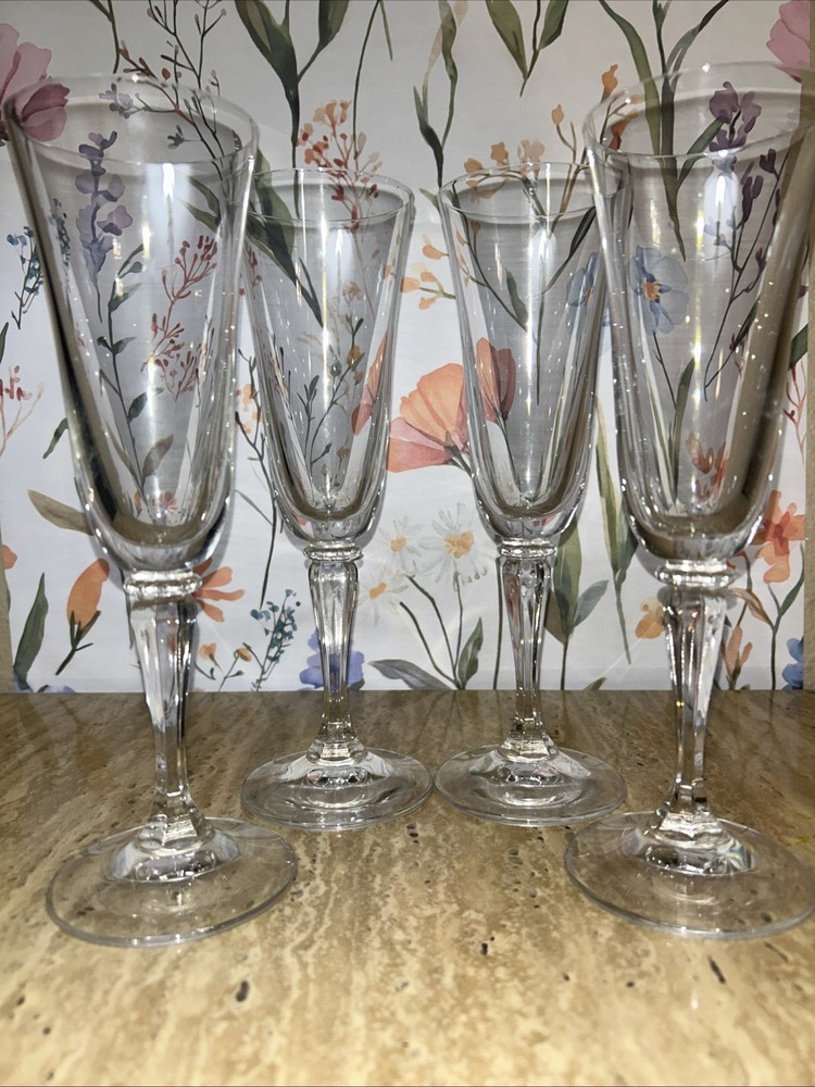 Set of 4 Mikasa Wheaton Like glass fluted champagne flutes with twisted stems.