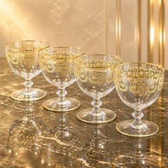 Set Of 4 Baccarat crystal gilded water goblet in the Flora pattern. Signed