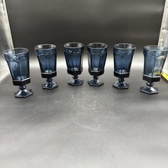 Set of six dark blue glass goblets with paneled design