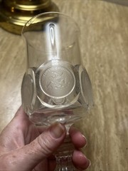 Decorative glass goblet with applied United States themed medallions.