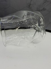 (1) double-walled glass tumbler features a unique twisted, ergonomic design