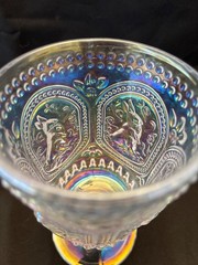 Beautiful iridized clear glass goblet with a bunny rabbit theme. 6 inches tall.