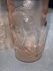 Set of 4 pink juice glasses (4-3/4”h) with fruit motif. Made in Italy
