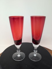 Pair Of ruby red crystal champagne glasses With Edged Flower