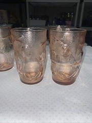 Set of 4 pink juice glasses (4-3/4”h) with fruit motif. Made in Italy