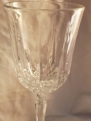 Vintage Crystal Glassware holds 10 ounces of liquid. The glass is 8 inches tall